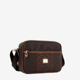 A dark brown crossbody bag with a matching front pocket featuring embossed branding, brown leather trim, and gold-tone hardware #color_darkbrown / saddlebrown