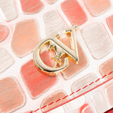 A structured handbag with a curved flap, featuring a red and white crocodile-embossed pattern, a bright red top handle, and a small gold-tone logo clasp at the center #color_red