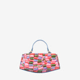 A structured handbag with a multicolor woven pattern of pink, green, and purple rectangular blocks, featuring a light blue top handle and gold-tone hardware, set against a plain light gray background. #color_pink