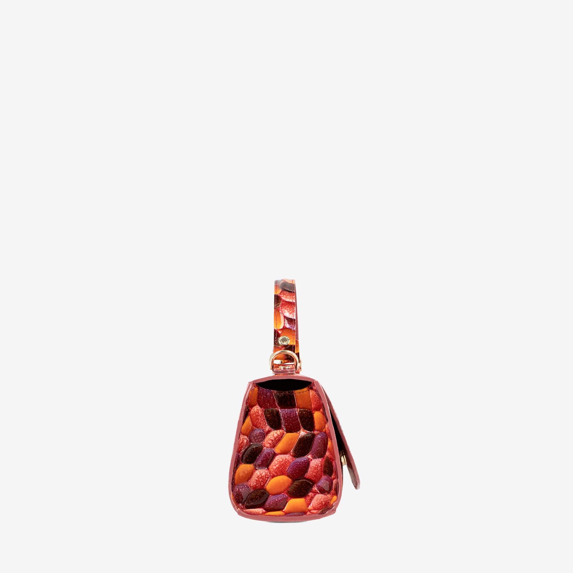 A small structured handbag with a glossy embossed pebble pattern in shades of orange, red, and brown, featuring a matching top handle and a small leather tag, shown against a plain light gray background. #color_orange