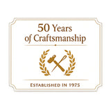 Logo celebrating 50 years of craftsmanship with a hammer and laurel wreath design on a white background.