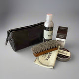 Walters' Gentlemen Leather Care Kit products, including a brush, cleaners, and pouch #color_black